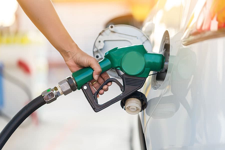 Hand Man Refill and filling Oil Gas Fuel at station. Gas station - refueling. To fill the machine with fuel. Car fill with gasoline at a gas station. Gas station pump.